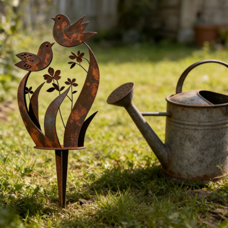 Iron garden stake with bird and flower motif